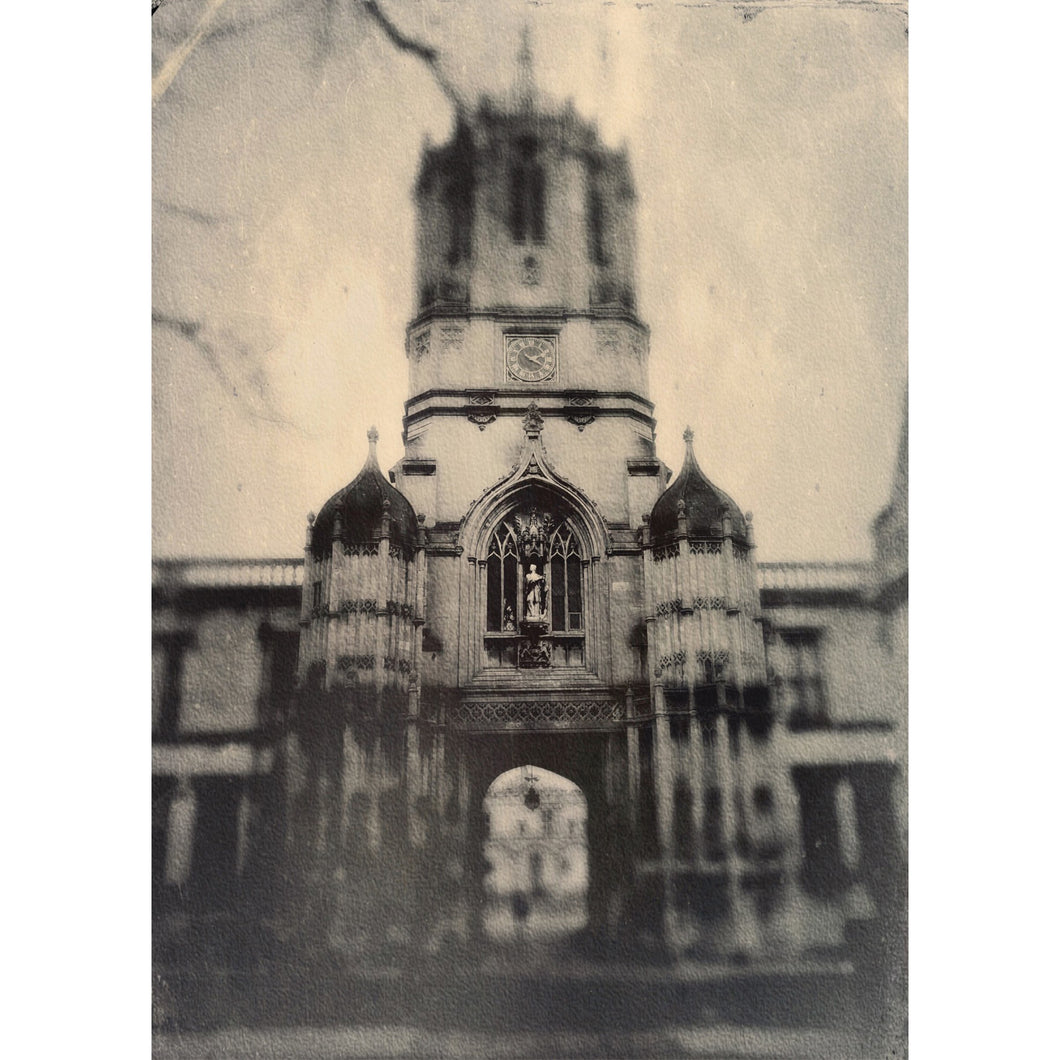 a black and white photo of a clock tower 